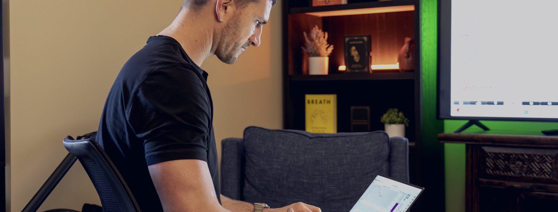 Dr. Jay Wiles at his desk, physiological data on the screens behind him